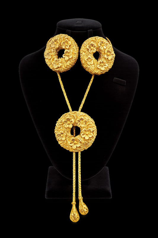 Gold floral wreath medallion bolo-style necklace with drop pendants