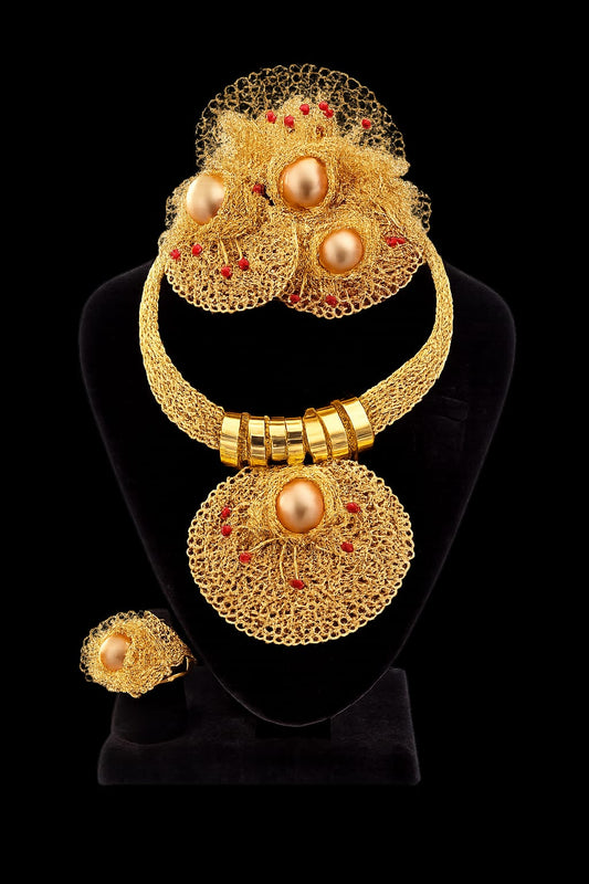 Gold woven mesh necklace with pearl centers and coral bead accents, matching ring