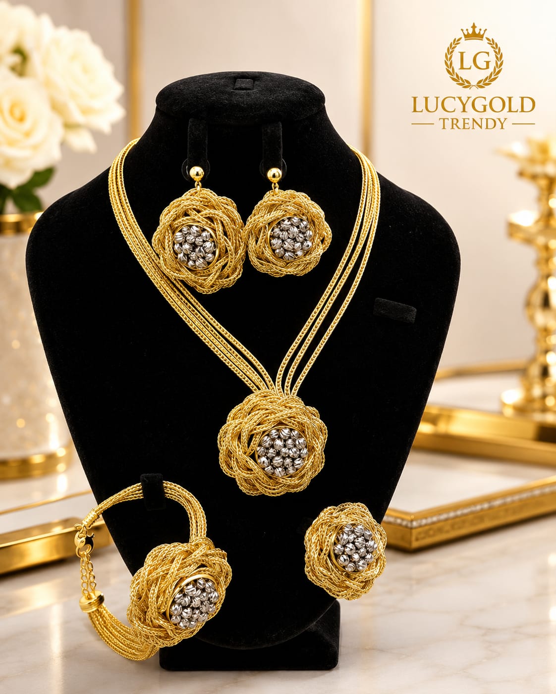 Gold woven rose knot necklace with silver crystal center, matching bracelet, earrings and ring
